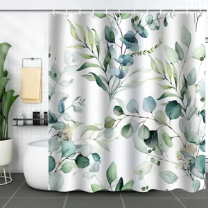 Detail view of green watercolor eucalyptus leaves on a white fabric shower curtain.