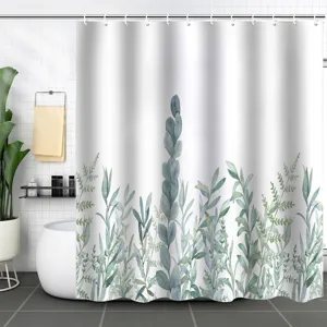 Detailed view of white waterproof shower curtain with green leaf pattern in a modern bathroom