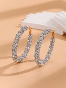 Sparkling crystal encrusted large hoop earrings detail view showing the exquisite craftsmanship.