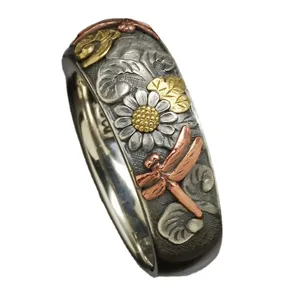 Retro multi-color carved metal ring featuring flower, dragonfly and sunflower for daily wear.