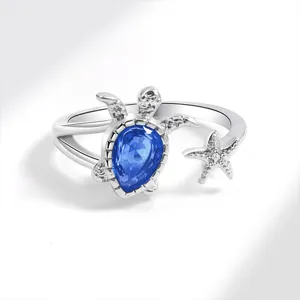 Silver turtle and starfish open ring with blue gemstone, ocean beach summer jewelry for women.