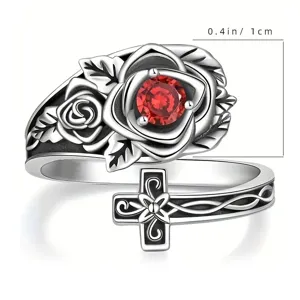 Close-up view of the vintage silver ring featuring an ornate rose and a detailed cross.