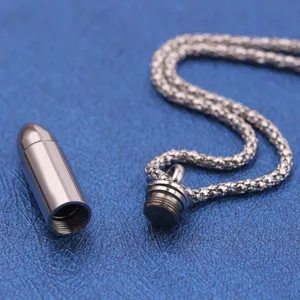 Stainless steel bullet pendant necklace detail, openable urn cremation jewelry for men.