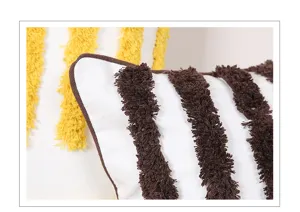 Close-up detail of Nordic tufted stripe throw pillow, soft textured cushion fabric surface.
