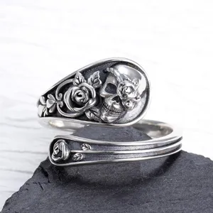 Vintage gothic skull and rose adjustable open ring for men and women, statement jewelry piece.