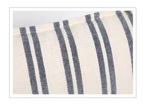 Close-up view of blue and white striped fabric cushion cover texture detail showing quality.