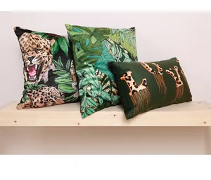 Tropical jungle throw pillow covers with leopard and palm leaf print set of three.