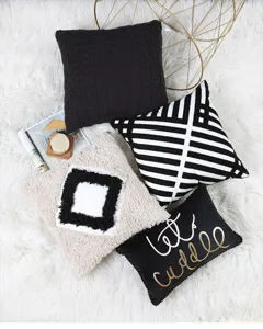 Set of 4 decorative throw pillows with black, white, tufted, and striped boho modern designs.