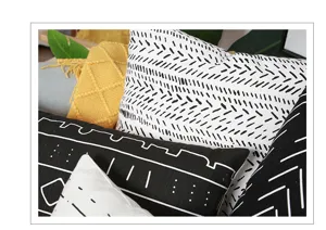Cotton linen throw pillow cover detail, modern black and white geometric pattern cushion case.