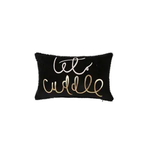 Black decorative throw pillow with cursive text print and pom-pom trim for sofa bed home decor