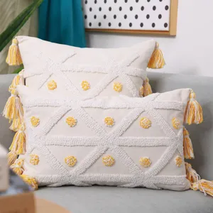 Nordic tufted throw pillow cover with geometric pattern and yellow tassels for home sofa.