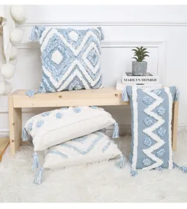 Nordic blue geometric tufted throw pillow detail, textured tassel cushion cover for sofa.