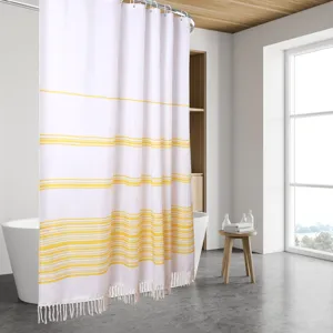 Modern minimalist white shower curtain with yellow stripes and tassel trim for bathroom