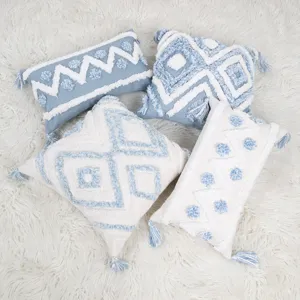 Nordic blue geometric tufted throw pillow with tassels, cozy sofa cushion for home decor.
