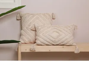 Beige tufted throw pillow cover bohemian style decorative cushion detail shot tassel