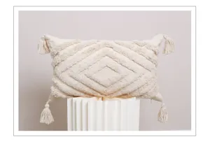 Boho tufted throw pillow cover detail view with geometric texture and cute corner tassels.