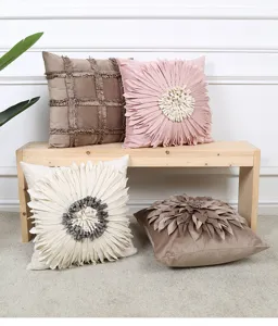 Decorative 3D flower throw pillow and stylish grid fringe cushion for modern living room sofa.