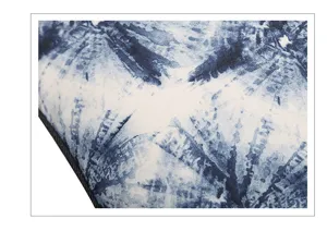Close up detail of blue and white tie dye linen pillow cover with digital print texture.