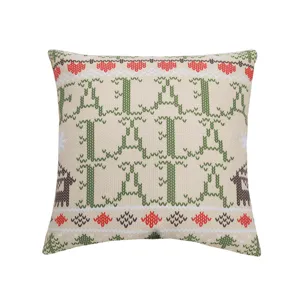 Christmas throw pillow with festive knit style Fa La La print and cute reindeer pattern.
