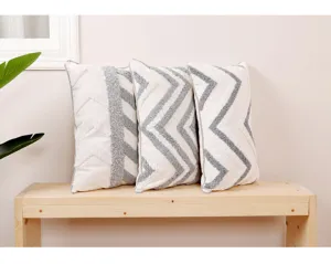 Modern geometric tufted throw pillow cover, cozy grey and white decorative cushion for home decor.