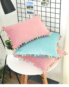 Nordic velvet pom pom cushion detail shot cozy living room sofa pillow decor aesthetic view