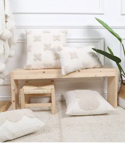 Detailed view of minimalist tufted throw pillow cover with geometric texture in cozy home setting.