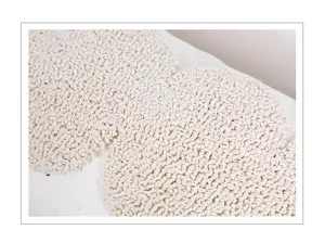 Close-up tufted pillow cover fabric detail, soft minimalist geometric cushion texture.
