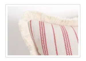Nordic striped throw pillow cover closeup, elegant tassel edge and textured fabric.