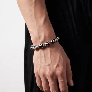 Close-up detail of Tibetan style dzi bead bracelet for men and women fashion accessories.