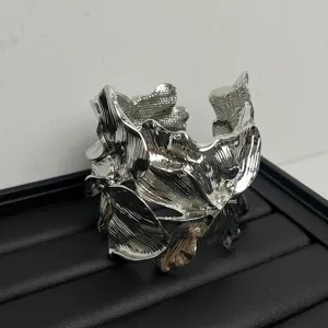 Silver metallic leaf cuff bracelet for women, trendy open bangle statement fashion jewelry.