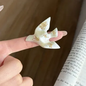 Exquisite bird shape open ring with white enamel and gold foil details, fashion chic accessory.