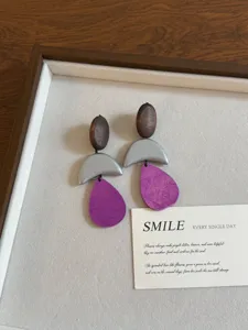 Geometric wooden and metal drop earrings with purple pendant, stylish vintage jewelry for women.