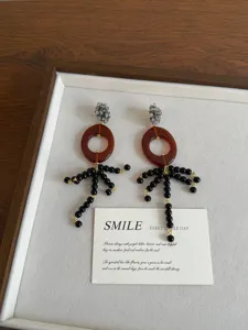 Vintage resin water drop earrings with black beaded tassels, unique chic statement jewelry for women.