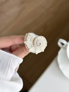 Exquisite handmade wire-wrapped seashell ring detail, unique ocean style jewelry for women.