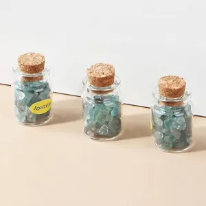 Natural Apatite crystal crushed stone specimens in small glass jars with cork stoppers