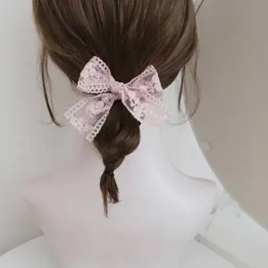 Elegant pink lace bow hair tie with floral embroidery for women's daily hairstyle