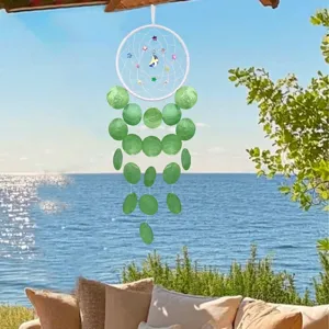 Handmade shell dreamcatcher wind chime with green discs for coastal home decor