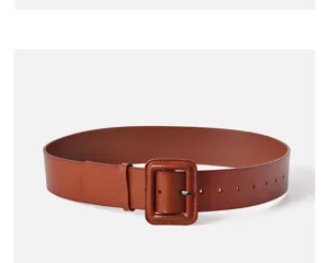 Close-up detail of wide brown leather belt with matching square buckle for women's trench coats.