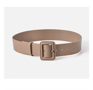Wide beige leather belt detail featuring wrapped square buckle close up photography