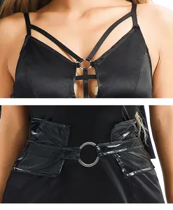 Detailed view of gothic costume chest straps and patent leather waist belt with metal rings.