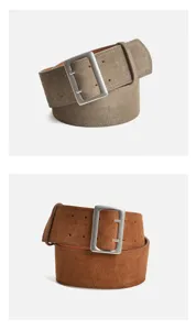 Suede wide belt detail showing premium matte leather texture and large metal buckle design.