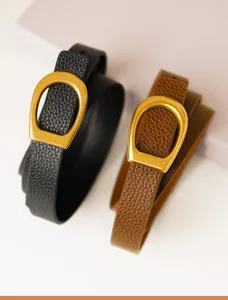 Detailed shot of women genuine leather belt with retro gold D-shaped buckle, stylish and chic.