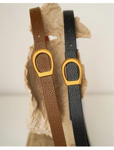 Genuine leather women belt detail, vintage retro design with elegant metal buckle for daily wear.