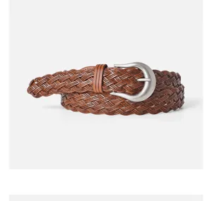 Close-up detail of the retro braided leather women belt showcasing fine texture and silver buckle.