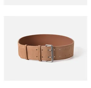 Detail shot of a brown suede leather belt with double prong buckle and double holes.