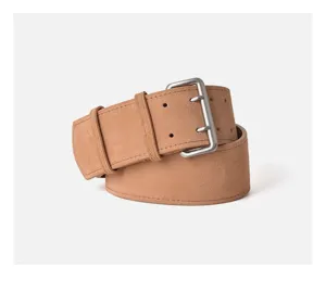 Close-up view of a women's camel suede leather belt featuring a sleek double-prong metal buckle.