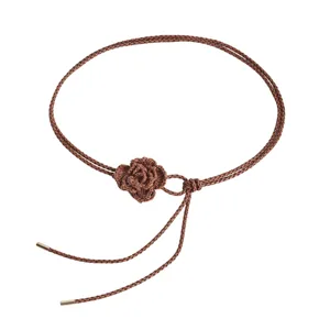 Brown braided waist chain for women with knitted flower charm and metal tips, main view.