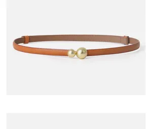 Elegant women's leather belt with a chic double gold sphere buckle, perfect for styling.