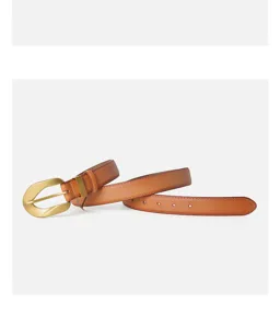 Close-up of brown genuine leather belt with retro gold metal buckle and neat stitching details.