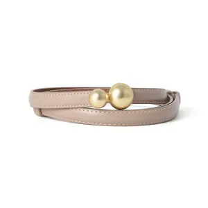 Genuine leather women's belt with double gold sphere buckle, elegant taupe waist accessory.